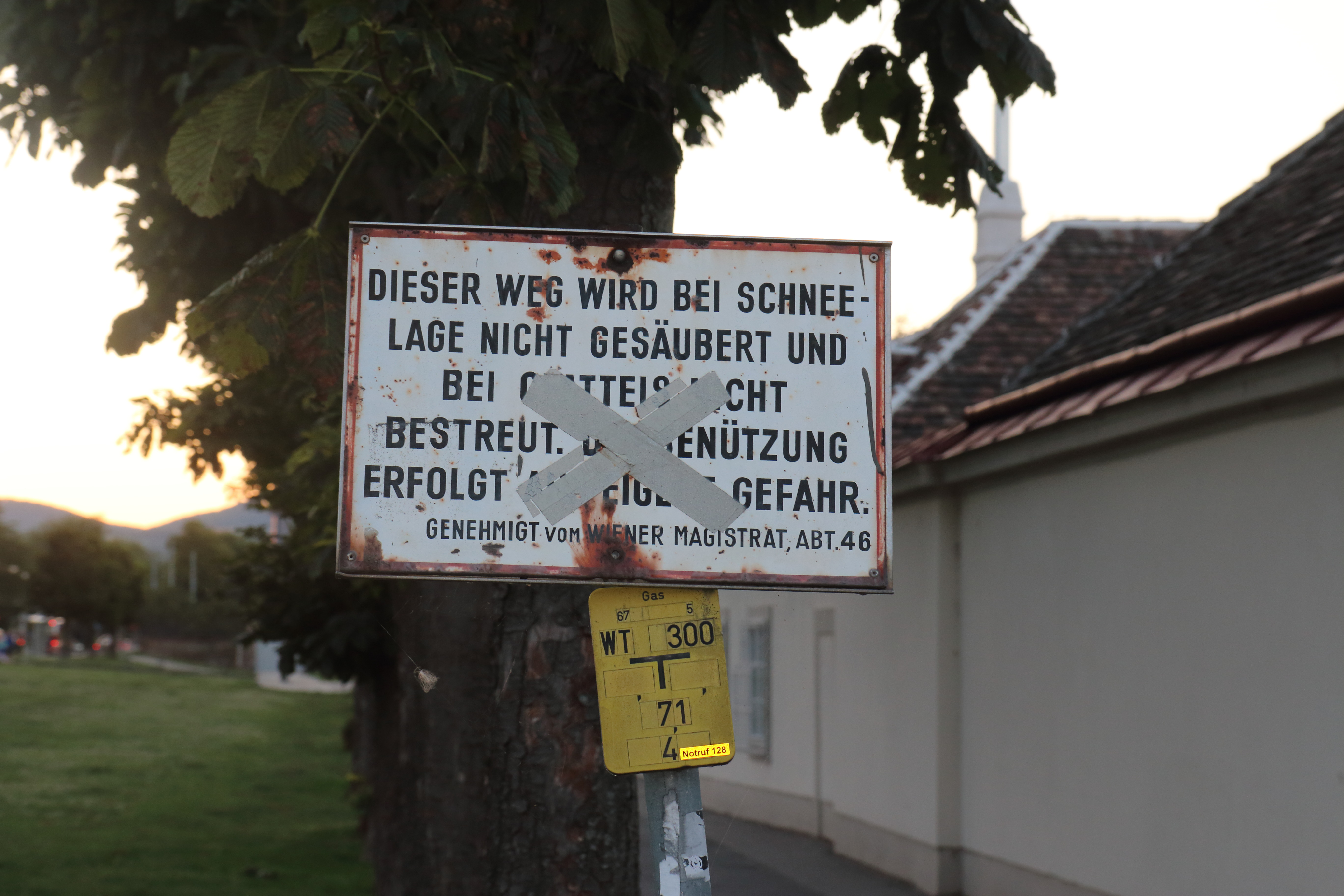 An old rusted sign, written German